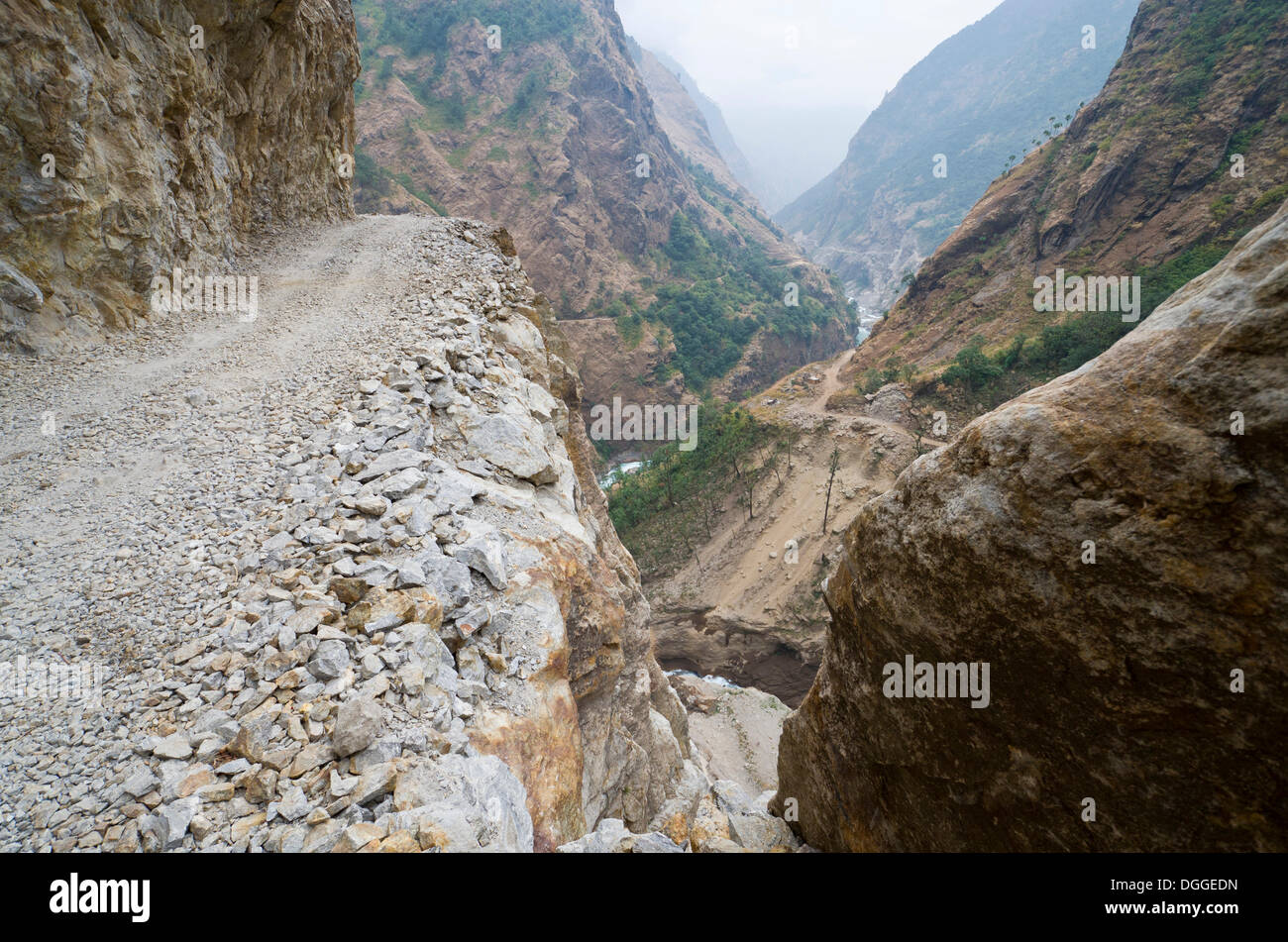 Newly constructed road in Marsyangdi Yuni valley, dangerously leading along a steep valley, Marsyangdi Valley, Lamjung District Stock Photo