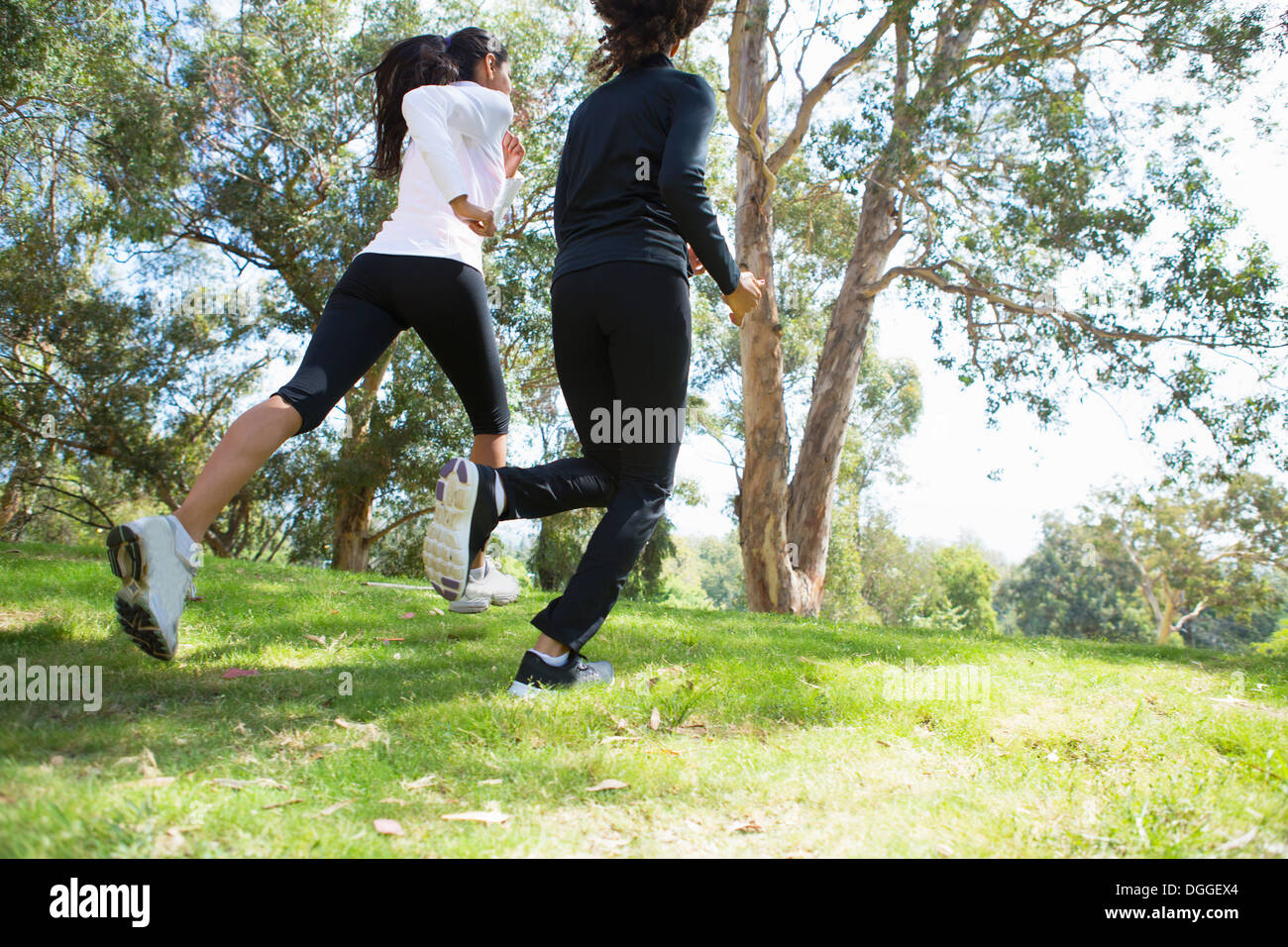 Young and mid adult woman jogging together Stock Photo