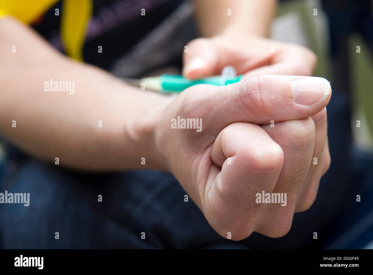 A syringe is being administered Stock Photo