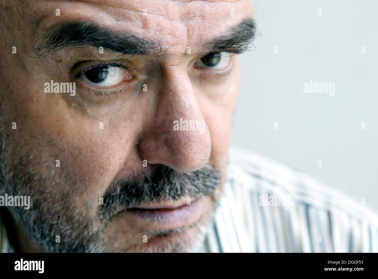 Portrait of a man with a scrutinizing look Stock Photo