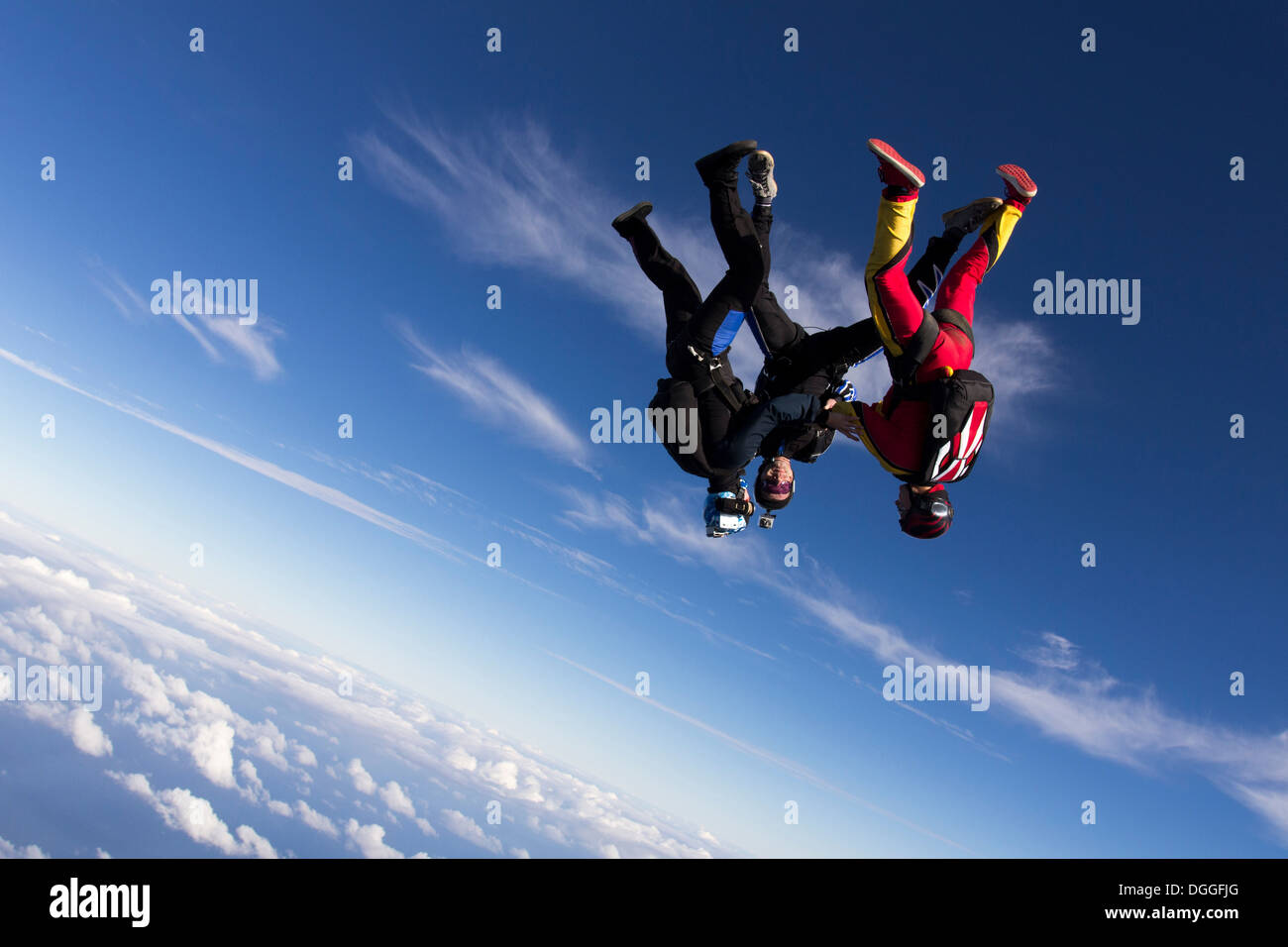 Formation skydivers free falling upside down Stock Photo