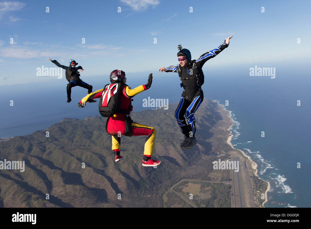 Three formation skydivers free falling Stock Photo