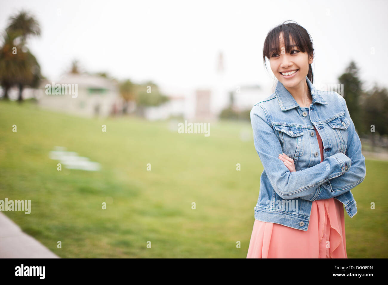 Portrait of young girl in park Stock Photo - Alamy
