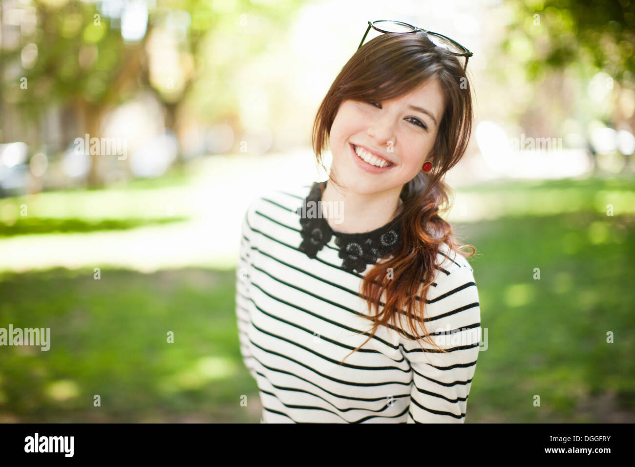 Portrait of young woman in park Stock Photo