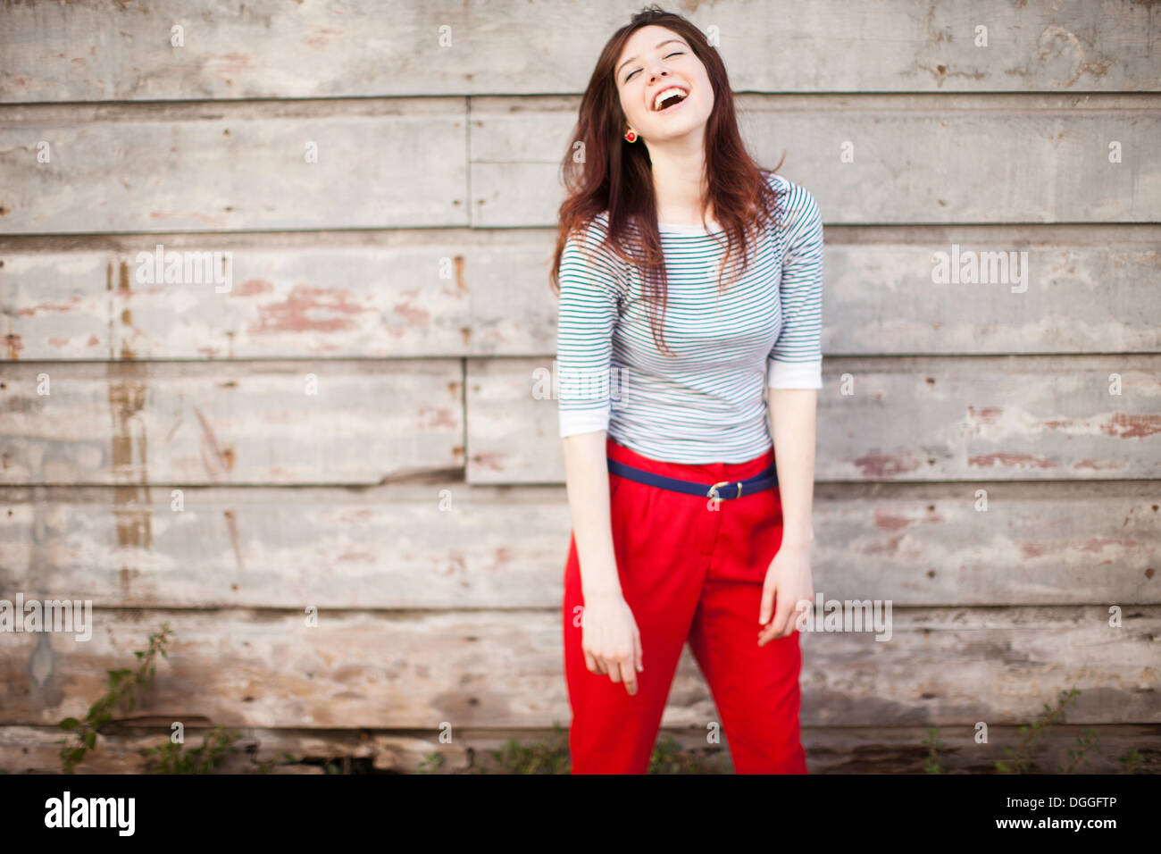 Portrait of young woman laughing Stock Photo