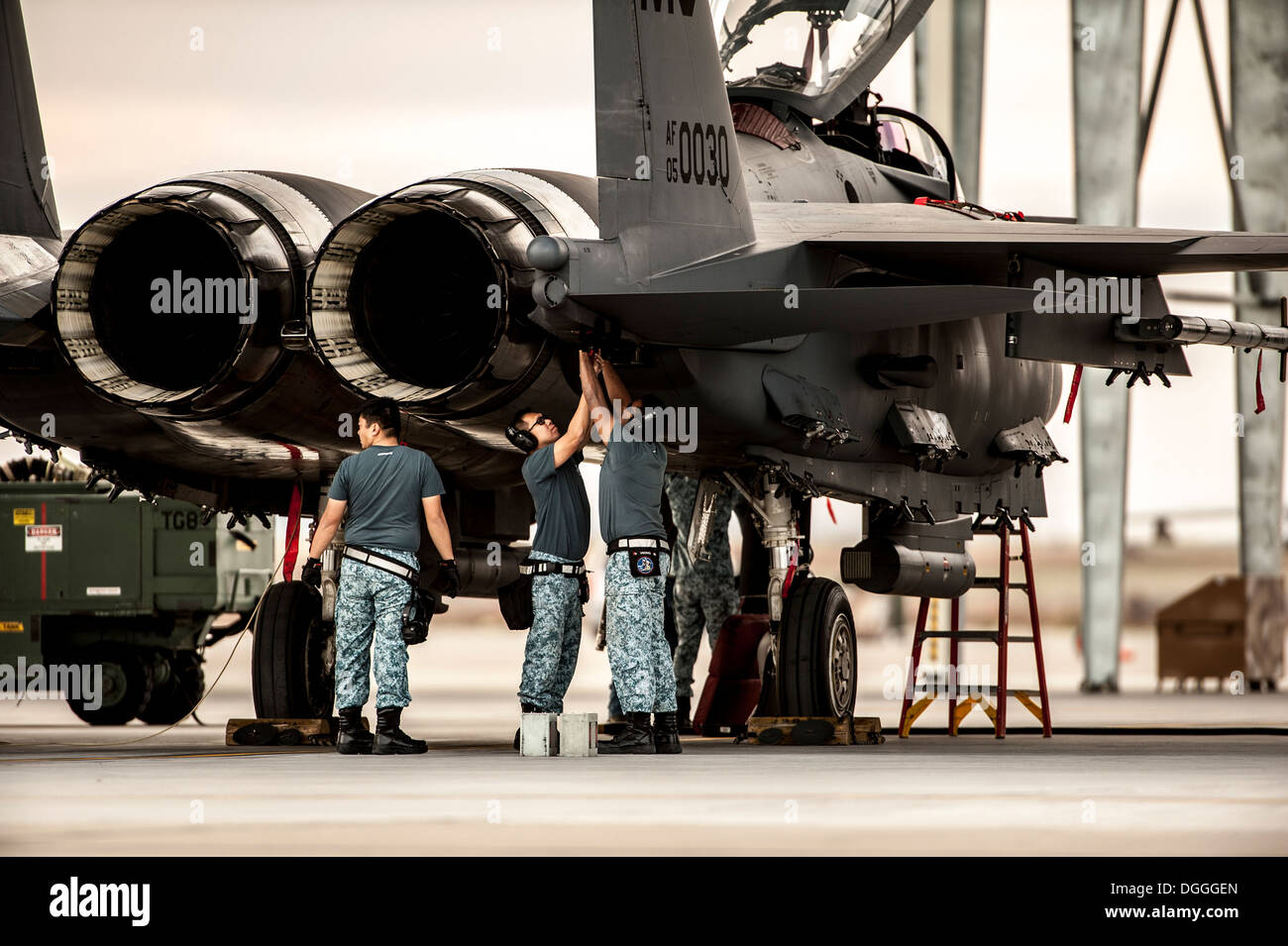 Republic of Singapore Air Force crew chiefs perform post-flight checks on their F-15SG Strike Eagle at Mountain Home Air Force Stock Photo