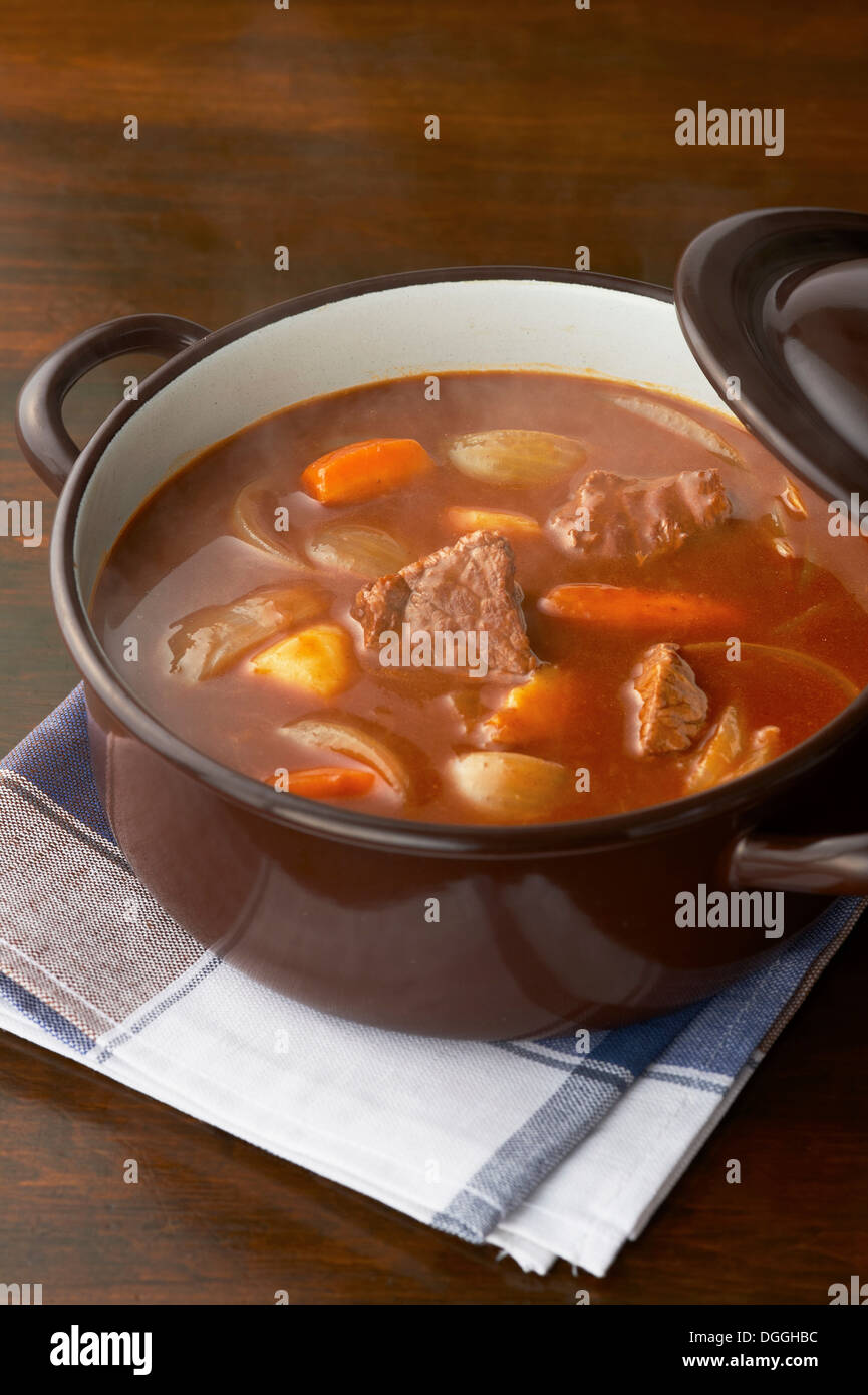Still life of meat and vegetables in casserole dish Stock Photo