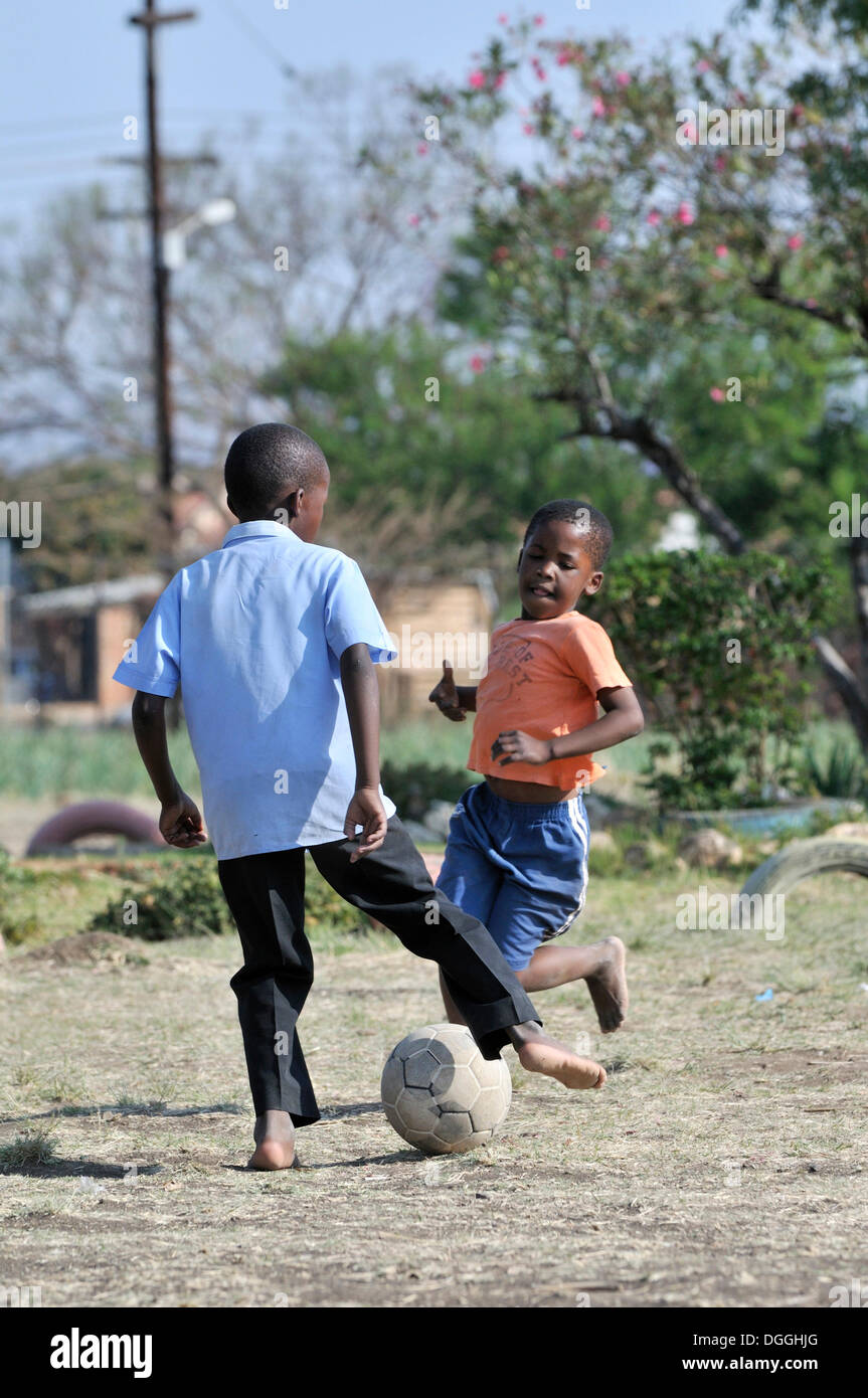 Two boys playing football, Cape Town, South Africa, Africa Stock Photo