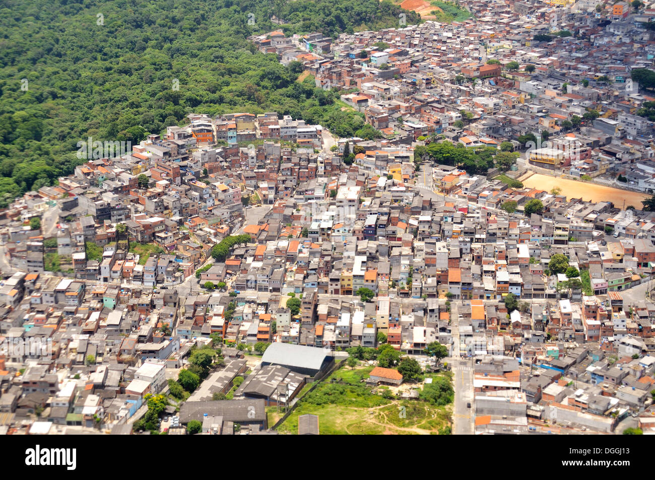 Aerial view of a Favela, slum area on the outskirts of Sao Paulo, town invading the rain forest, Sao Paulo, Brazil Stock Photo