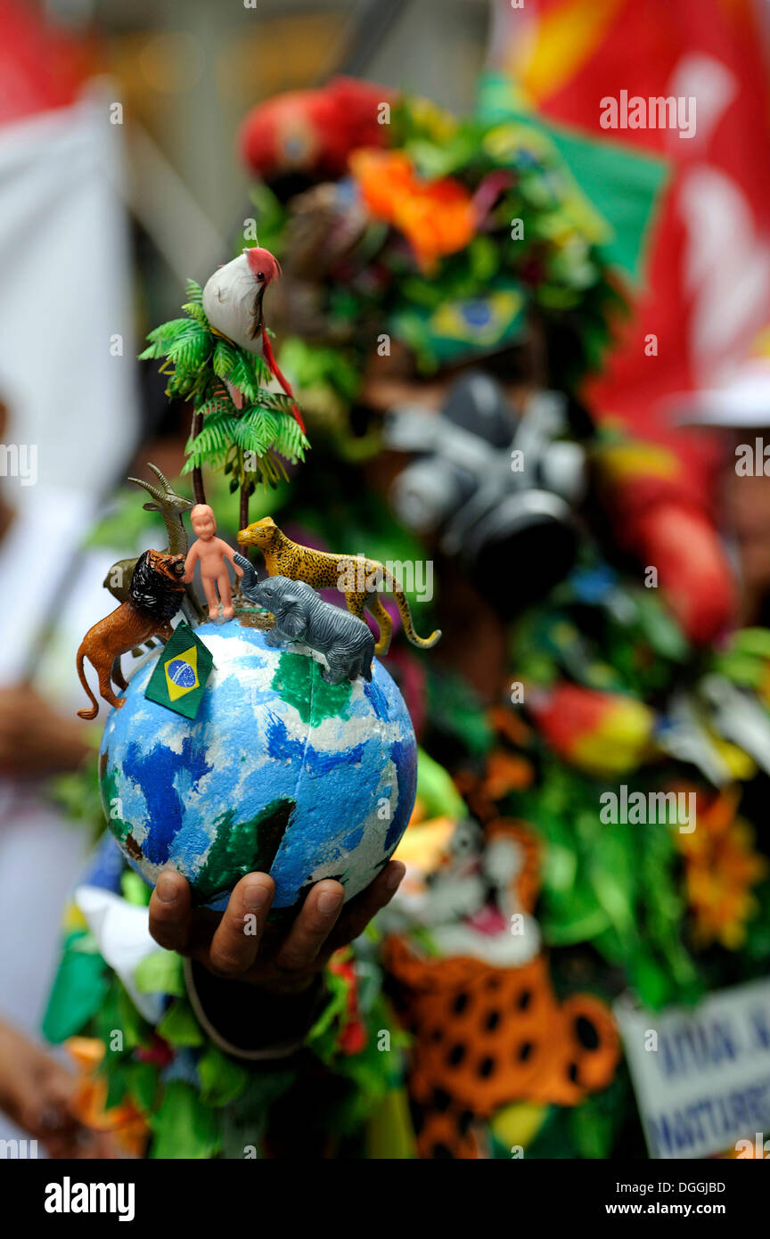 Demonstrator with globe with animals and plants, symbol of creation, UN Conference on Sustainable Development UNCSD or Rio +20 Stock Photo