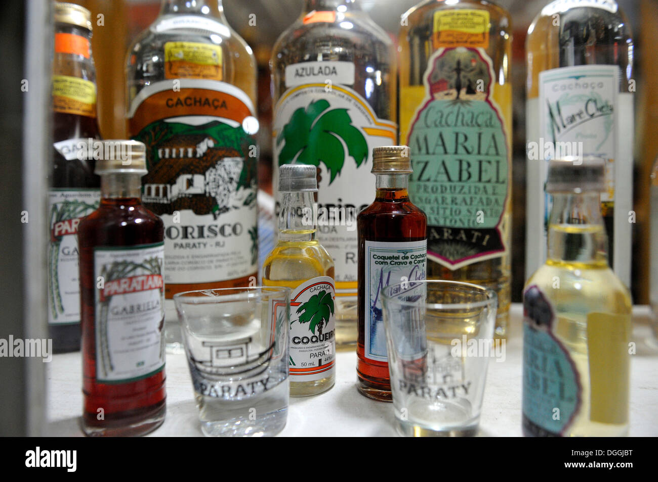Cachaca, liquor made from fermented sugarcane juice, national drink of Brazil, on sale in a shop in Paraty or Parati Stock Photo