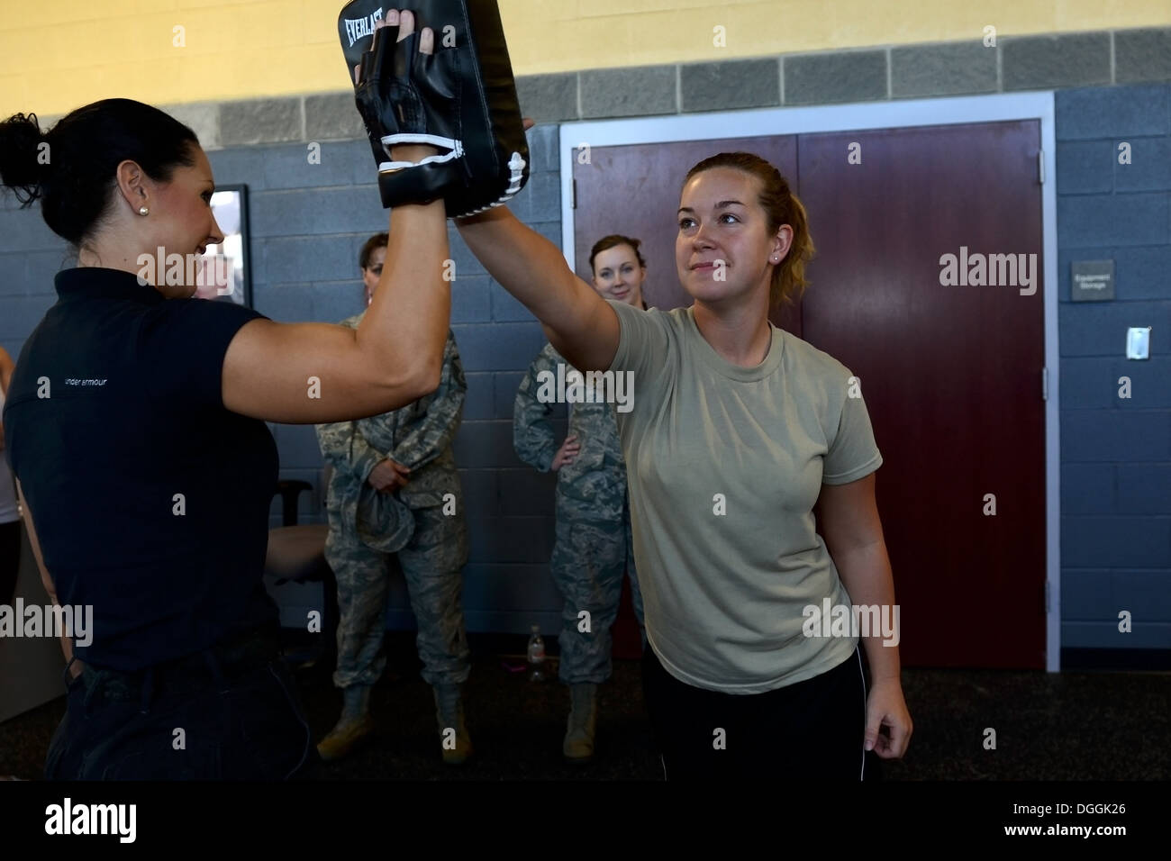 U.S. Air Force Airmen assigned to the 169th Fighter Wing at McEntire Joint National Guard Base, South Carolina Air National Guard, participate in a “females only” self-defense class provided by the Richland County Sherriff’s Department, Oct. 6, 2013. Stock Photo