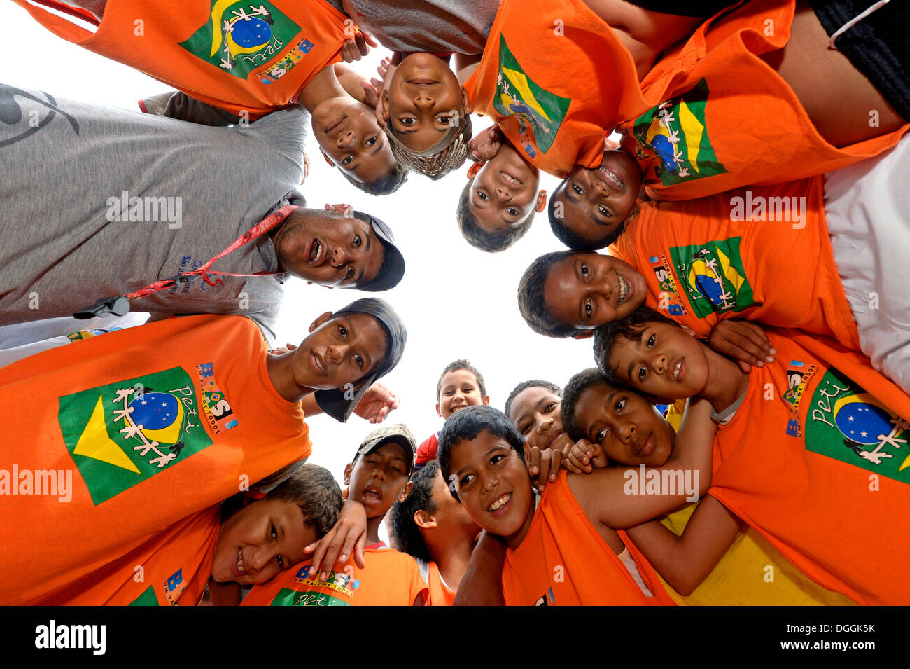Boys of a football team forming a circle, social project in a favela, Poxoréo, Mato Grosso, Brazil Stock Photo