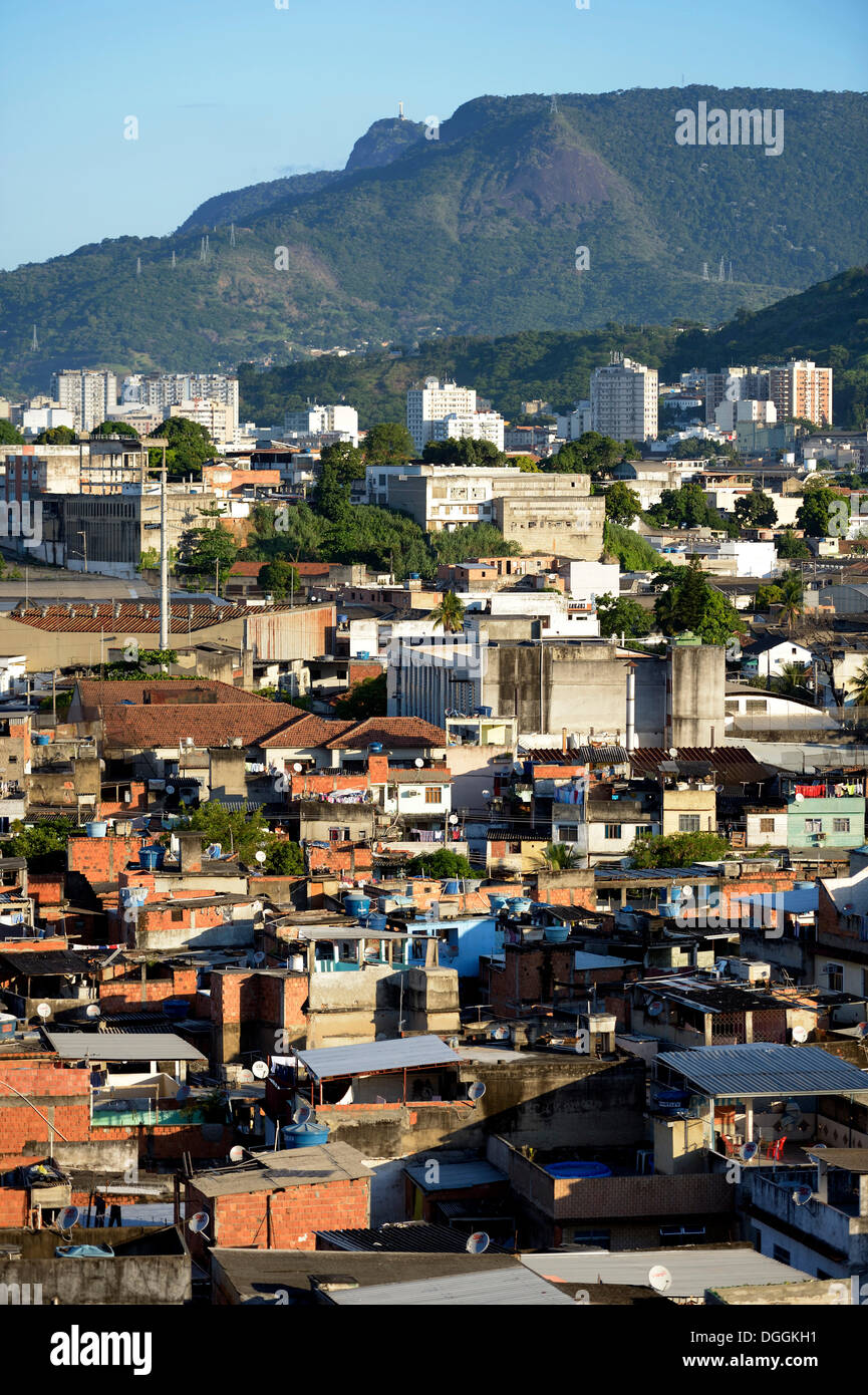 View over a slum or favela towards the high-rise apartment buildings where the urban middle class live Stock Photo