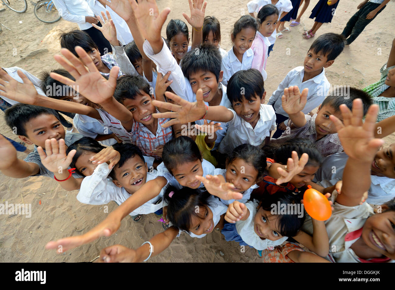 Children stretching their arms up, bird's eye view, Lompong Village, Bathi District, Takéo Province, Cambodia Stock Photo