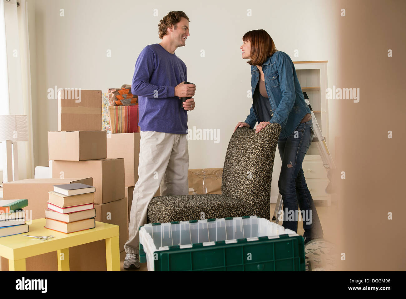 Couple in sitting room during house move Stock Photo