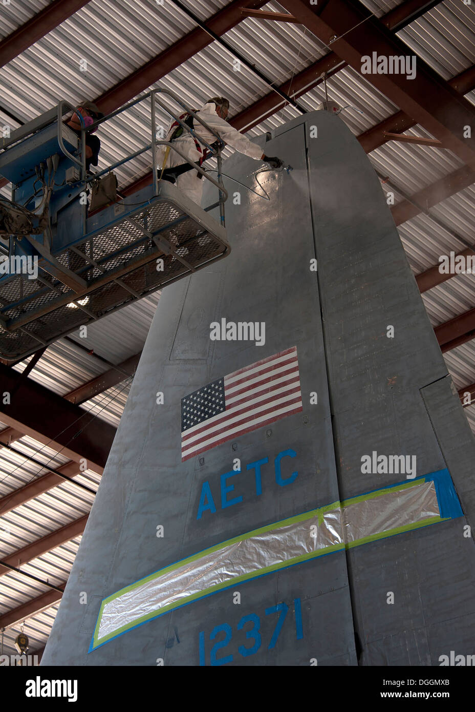 Mr. Larry Allen, Aircraft Painter, L3 Communications Integrated Systems Vertex Aerospace, apply paint to protect the C130 aircraft body from corrosion that can easily occur at high altitudes at Sheppard Air Force Base, Texas, Oct. 09. Aircraft painter’s r Stock Photo