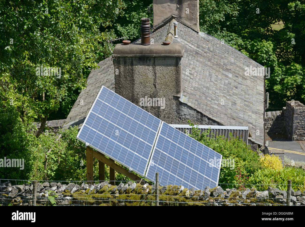 Solar panel installation in garden of house. Serpentine Road, Kendal