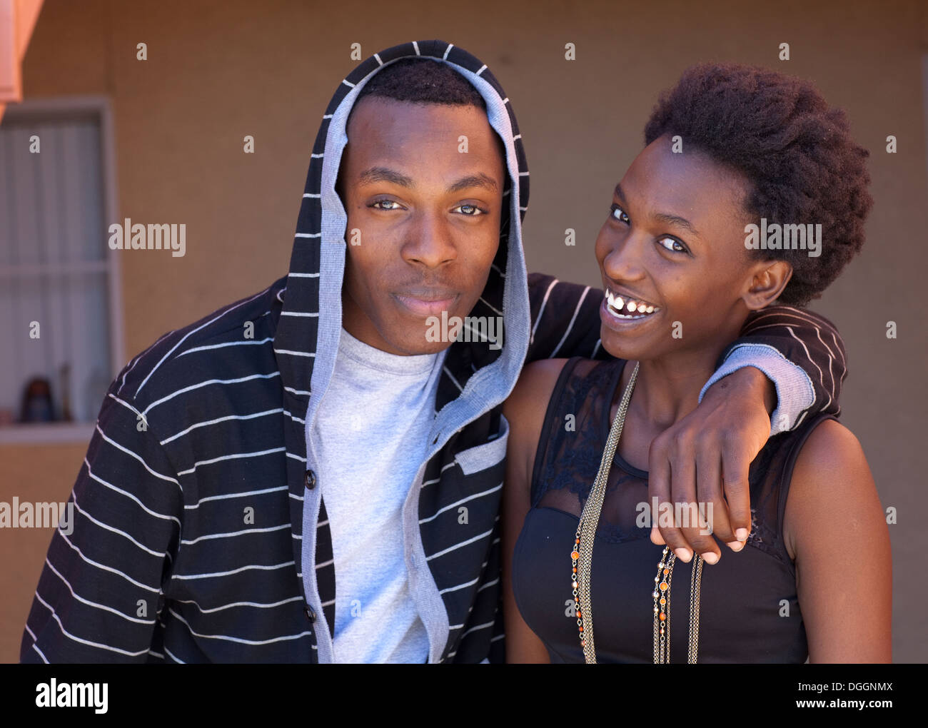 Brother and sister from Rwanda smiling at the camera. Stock Photo