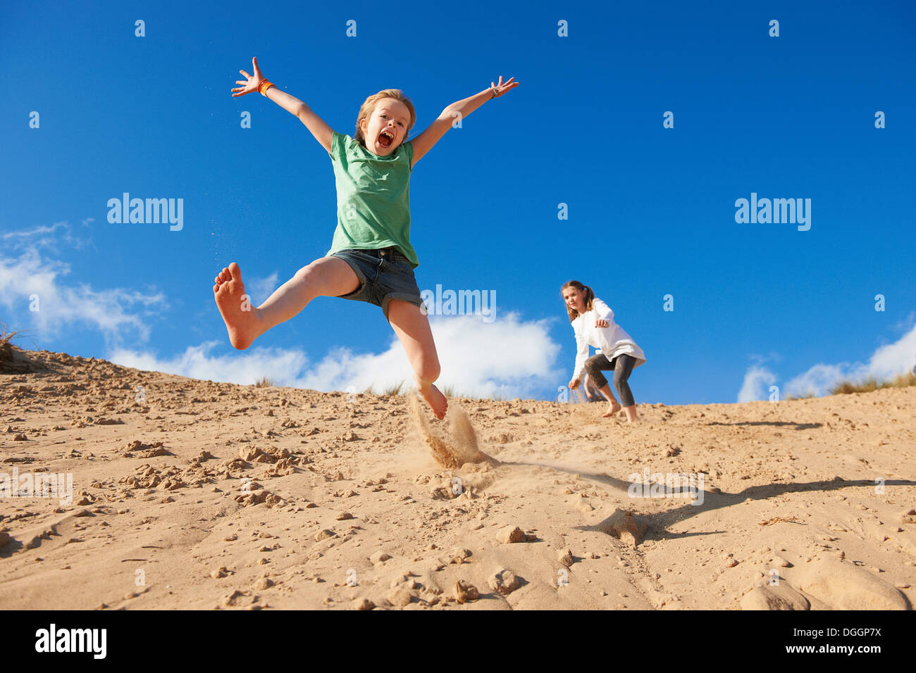 Two Girls Jumping High Resolution Stock Photography and Images - Alamy