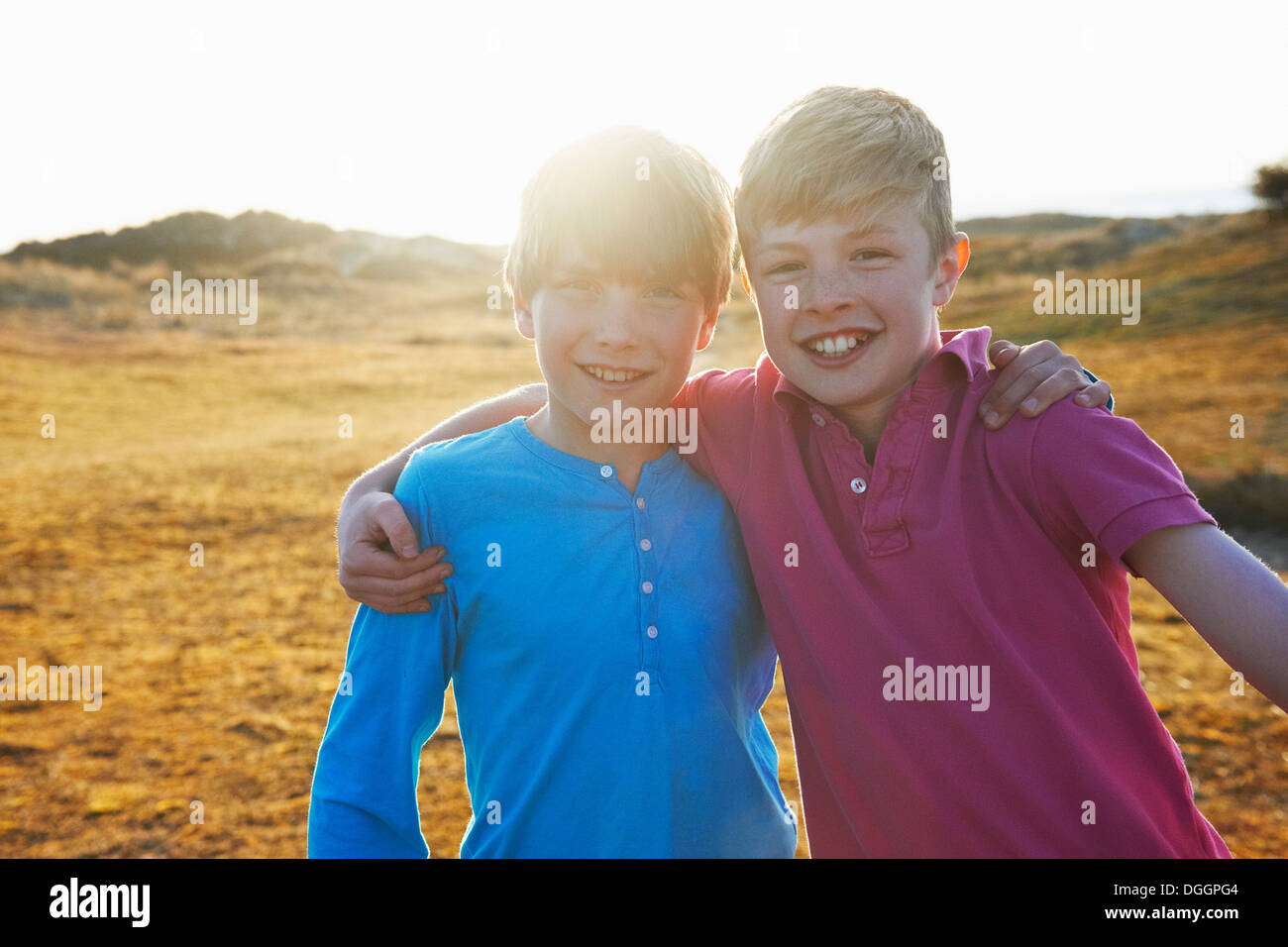 Two boys arms around other hi-res stock photography and images - Alamy