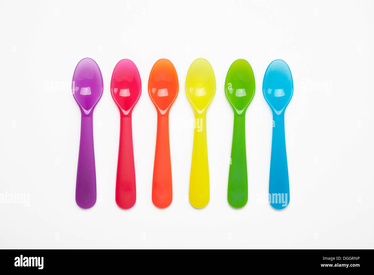 Colourful plastic spoons in a row Stock Photo Alamy