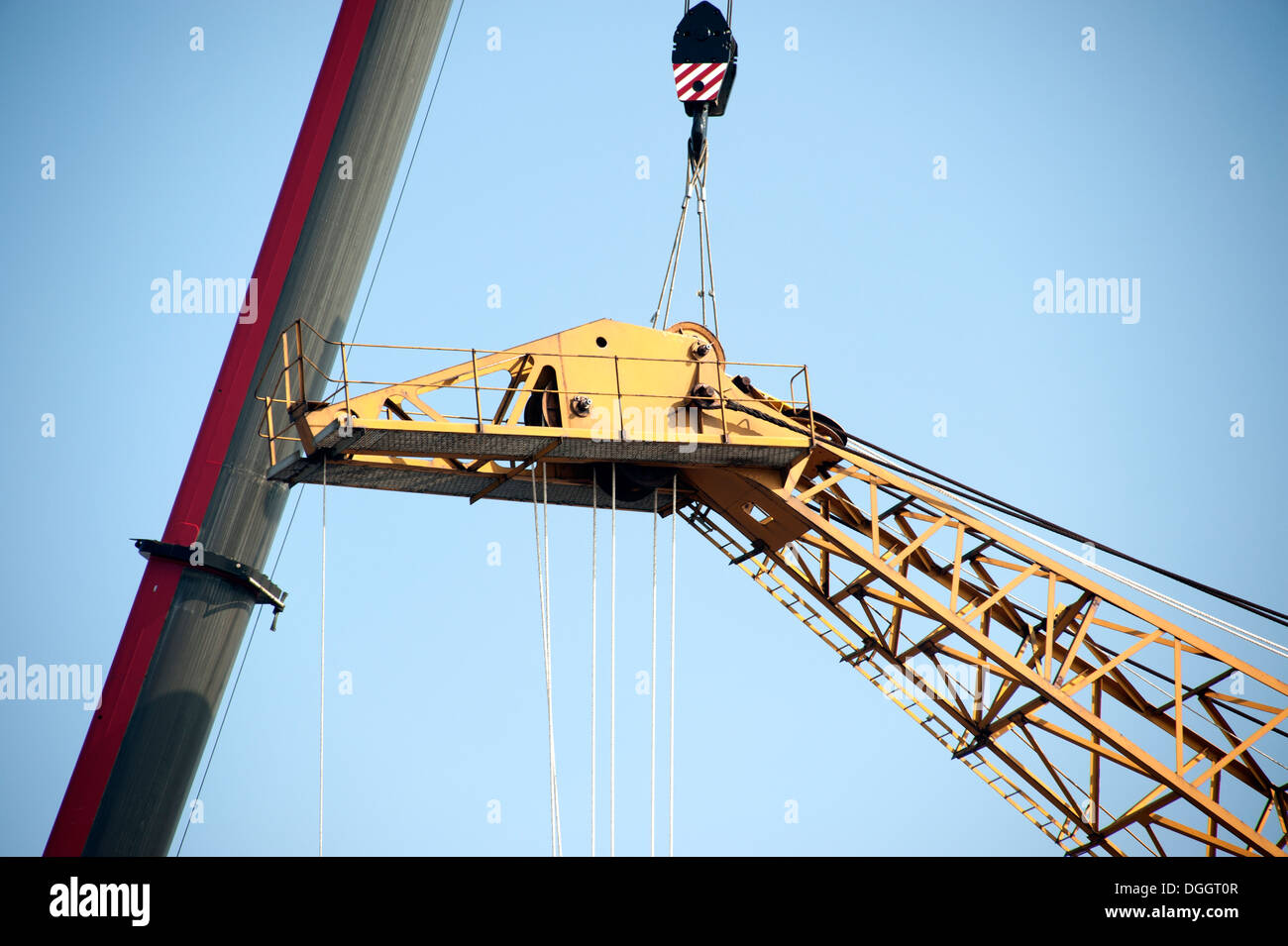 Large Crane being repaired by another crane Stock Photo