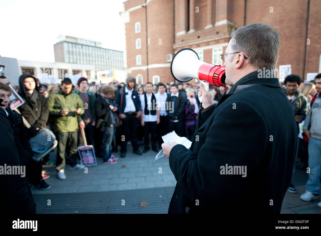 Man with Megaphone talking to crowds of people Stock Photo Alamy
