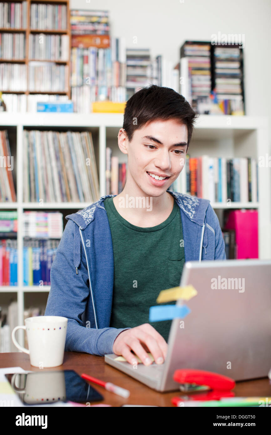 Young man working on laptop Stock Photo