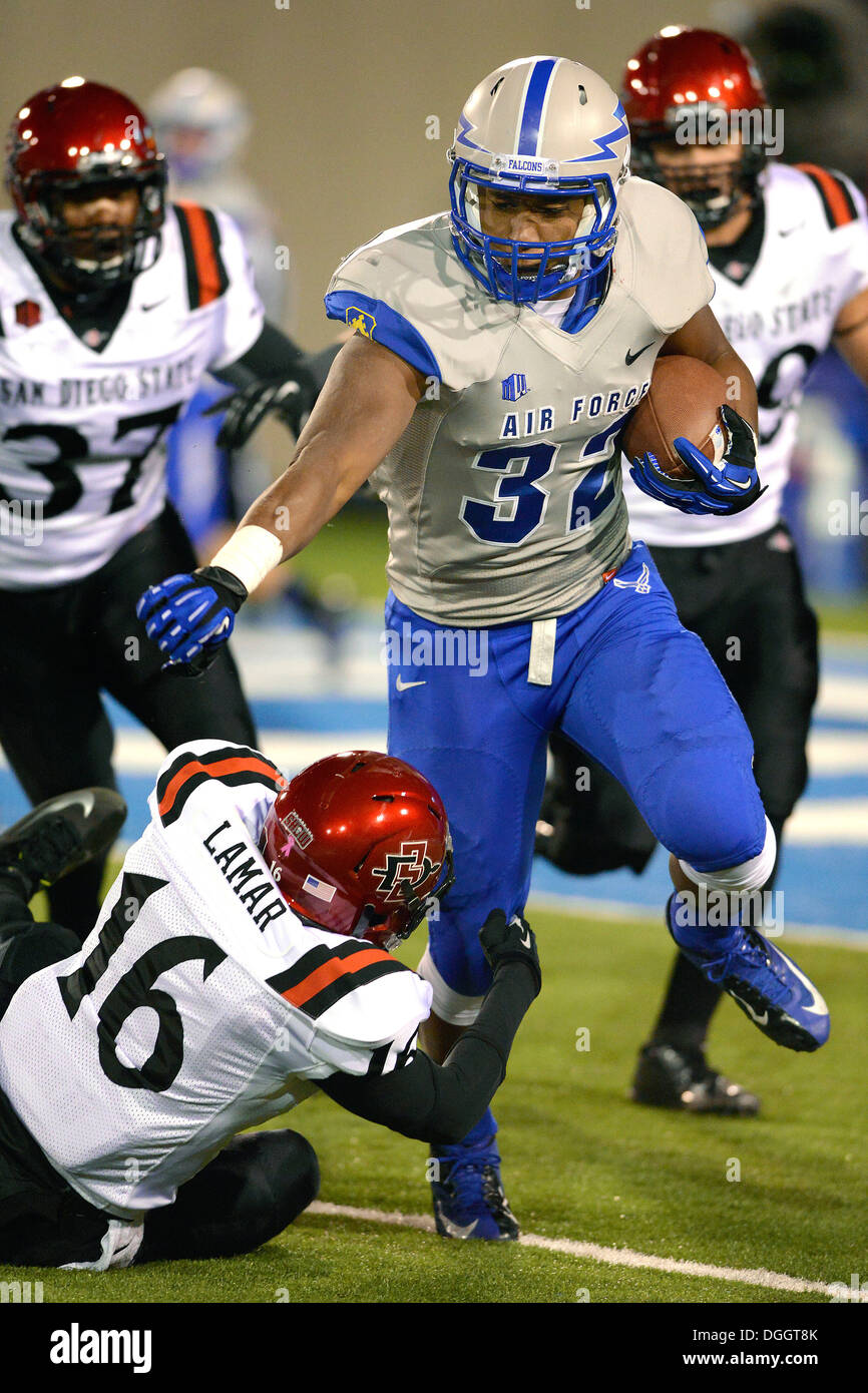 Falcon running back Broam Hart, a junior, runs past San Diego's David Lamar as Air Force meets Mountain West Conference rival San Diego State at the U.S. Air Force Academy's Falcon Stadium in Colorado Springs, Colo., Oct. 10, 2013. The Aztecs scored three Stock Photo