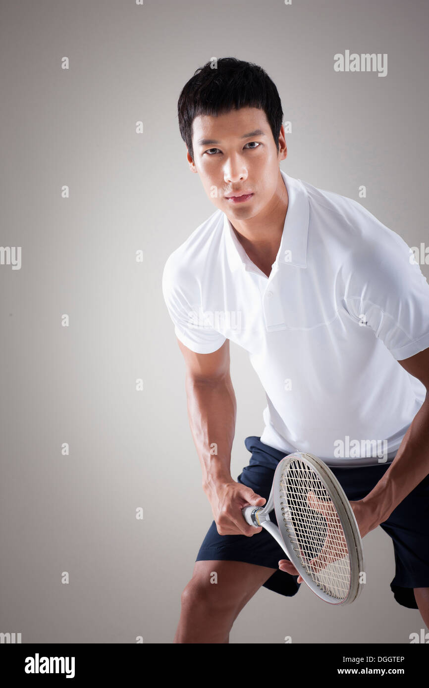 a man wearing tennis gear ready to play Stock Photo Alamy