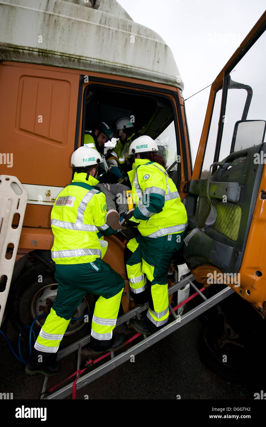 Paramedics rescuing Lorry Driver HGV SIMULATION Stock Photo