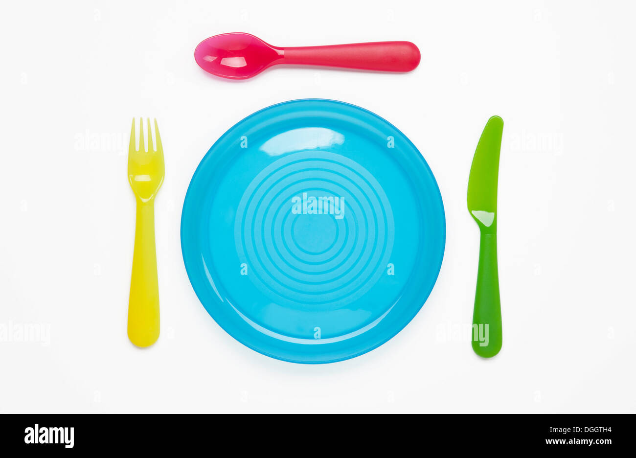 Colourful plastic plate and cutlery Stock Photo Alamy
