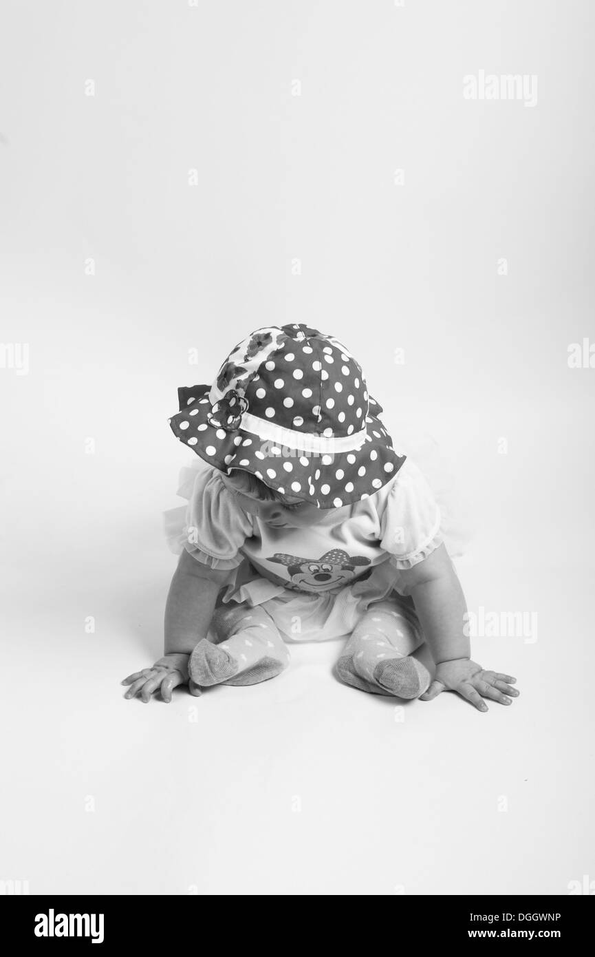 Baby girl in cute pose black and white Stock Photo