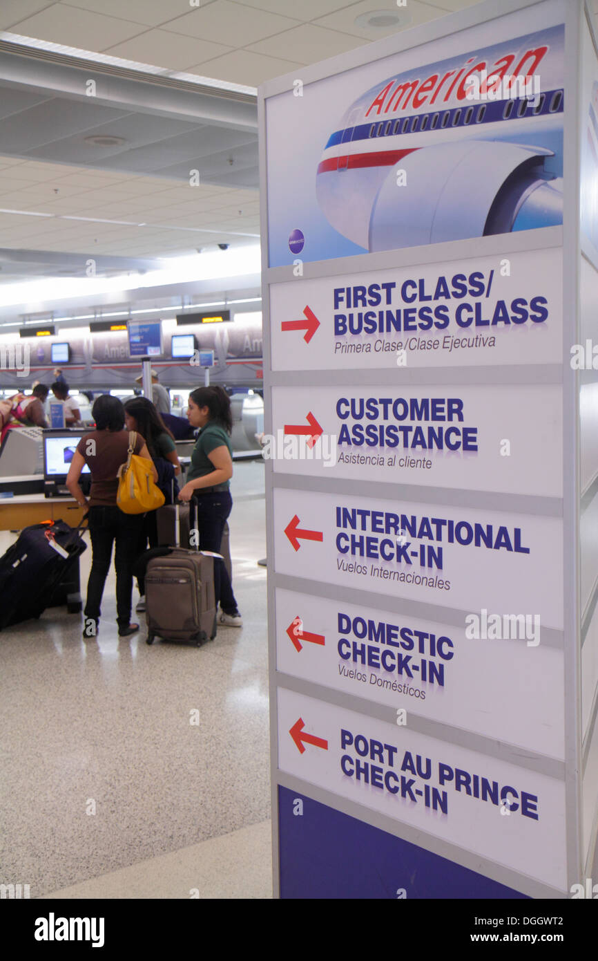 Miami Florida,International Airport,terminal,English Spanish,bilingual,American Airlines,check in,sign,looking FL130822008 Stock Photo