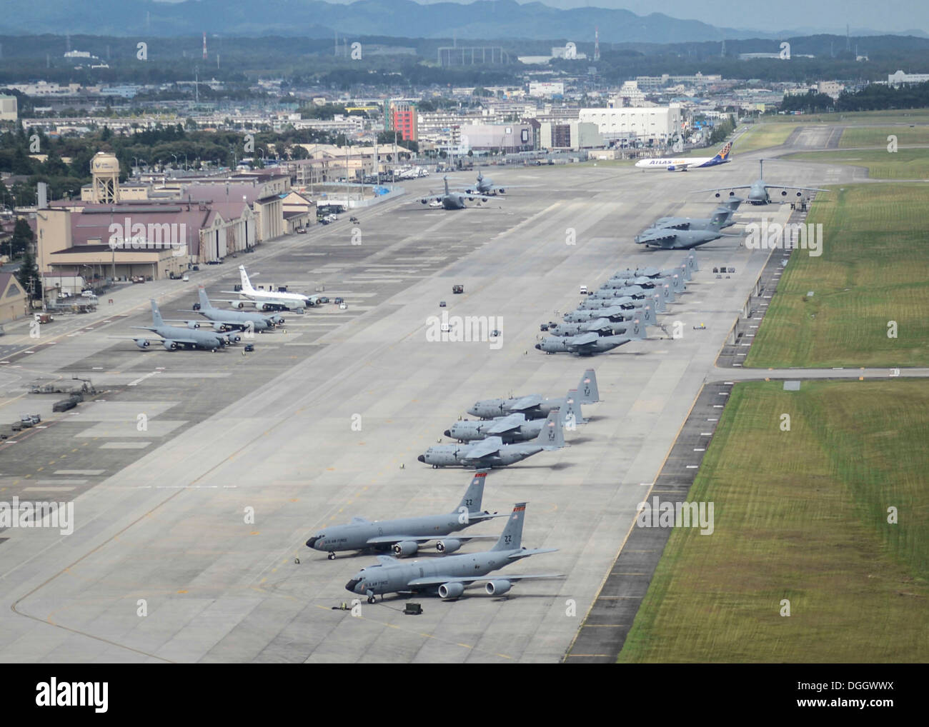Aircraft fill the taxiway at Yokota Air Base, Japan, Oct. 7, 2013. Eighteen aircraft from Kadena Air Base and Marine Corps Air Station Futenma diverted to Yokota due to the impact of two typhoons. Stock Photo