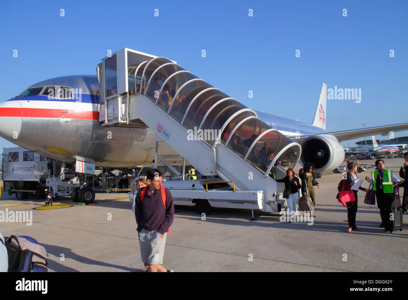 Paris France,Europe,French,CDG,Charles de Gaulle Airport,American Airline,arriving,passenger passengers rider riders,disembarking,tarmac,commercial ai Stock Photo