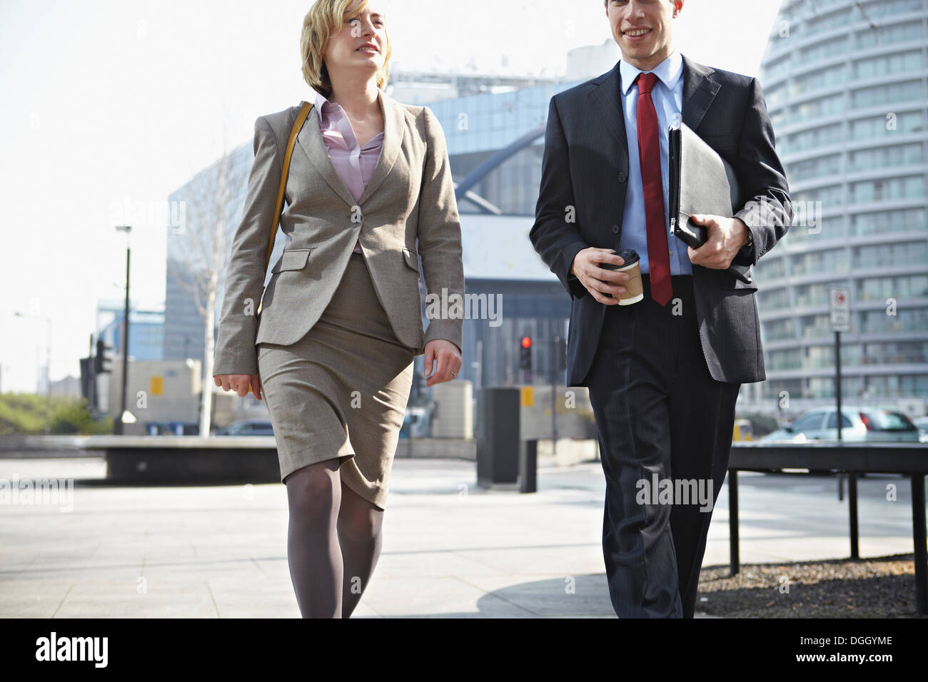Two businesspeople walking in city Stock Photo - Alamy