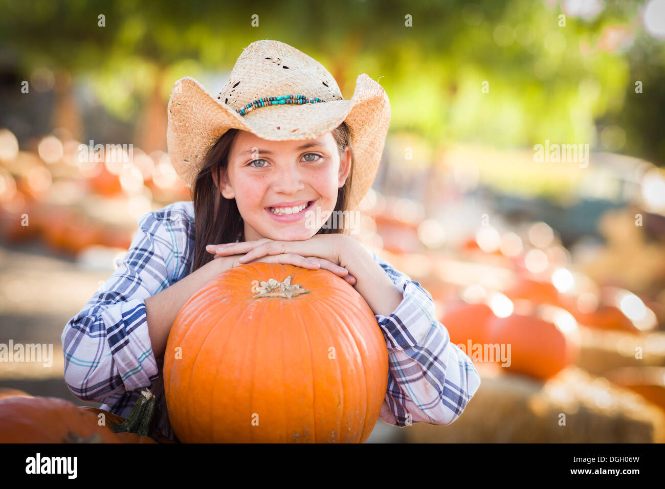 Preteen Girl Wearing Cowboy Hat Playing 