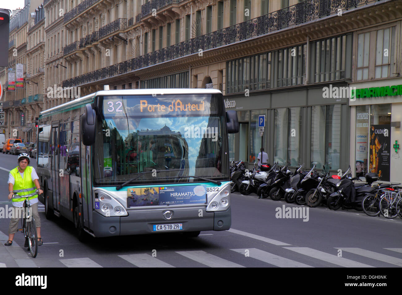 Paris France,9th arrondissement,Place d'Estienne d'Orves,Rue de Châteaudun,public bus,coach,adult,adults,woman female women,bicycle rider,biker bikers Stock Photo