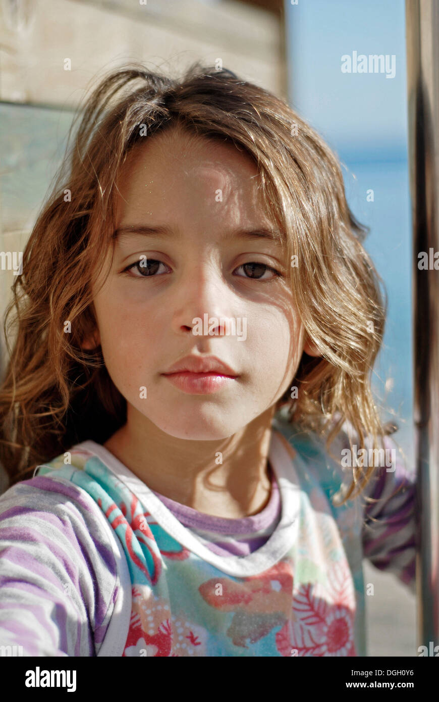 cute brazilian seven year old girl on the beach stock photo
