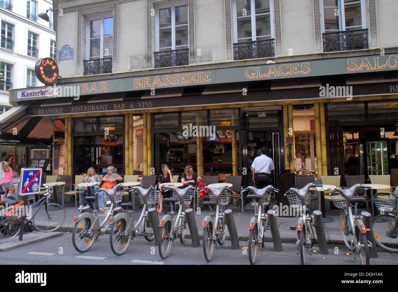 Paris France,9th arrondissement,Rue de la Victoire,Velib bike share station,restaurant restaurants food dining cafe cafes,cuisine,food,cafe,brasserie, Stock Photo