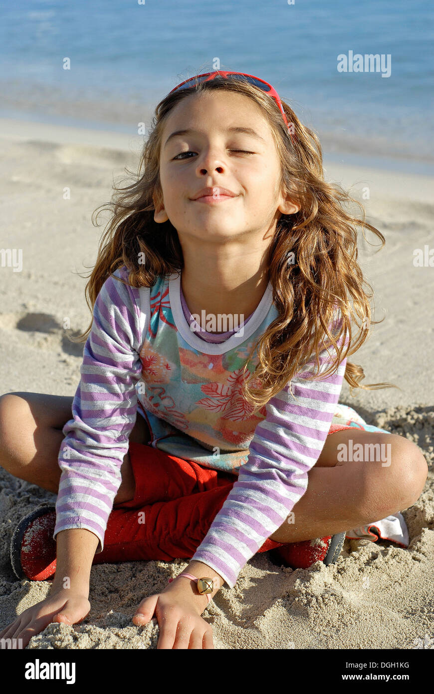 Cute brazilian seven year old girl on the beach Stock Photo