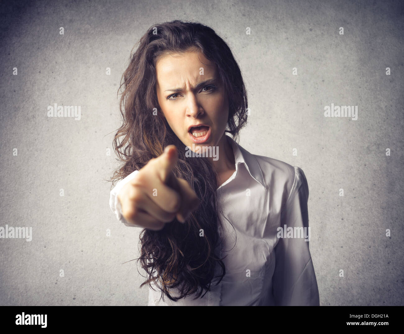 Portrait of a girl accusing someone with her index finger Stock Photo
