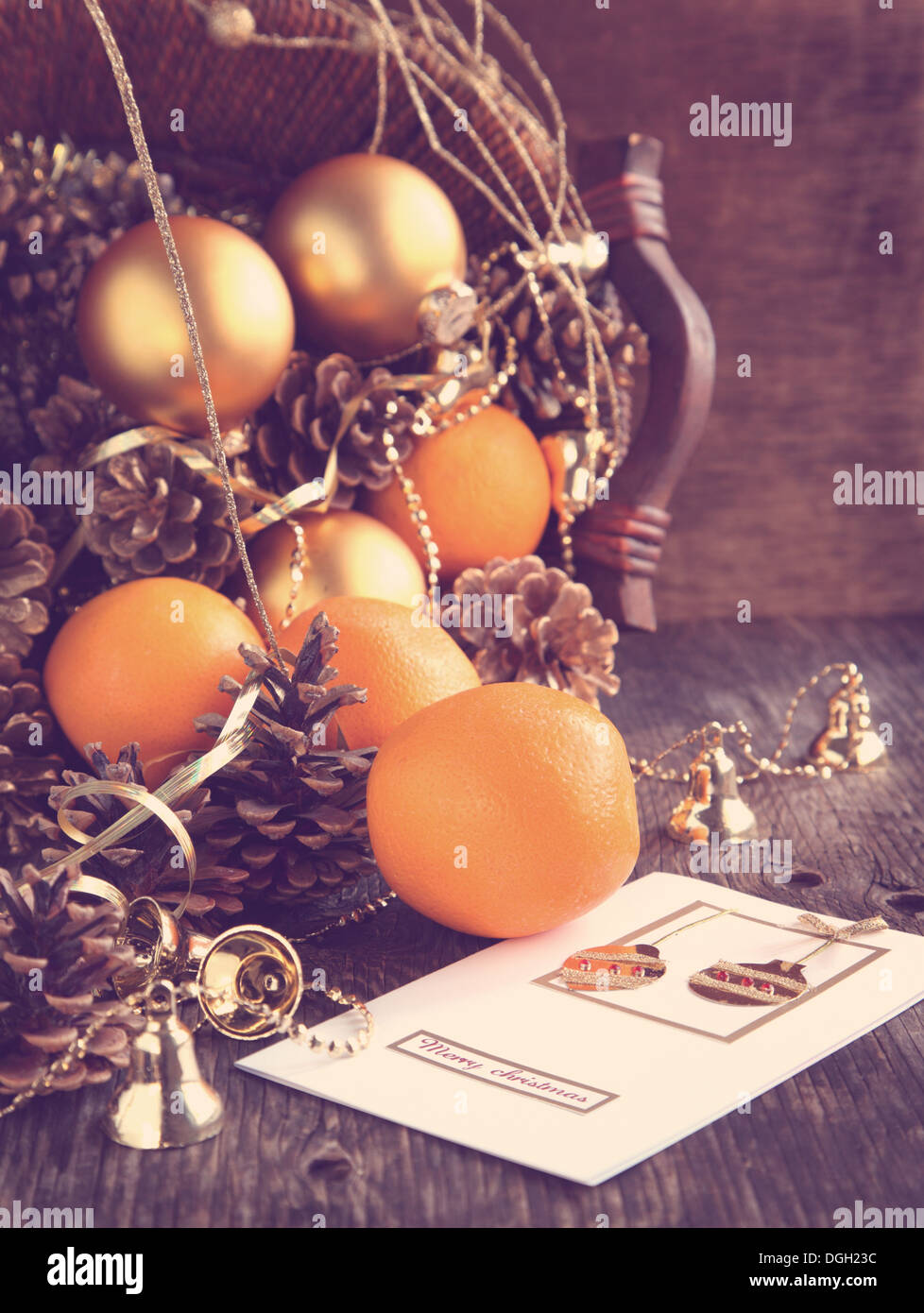 Christmas card and decoration with oranges, pine cones and ornaments Stock Photo