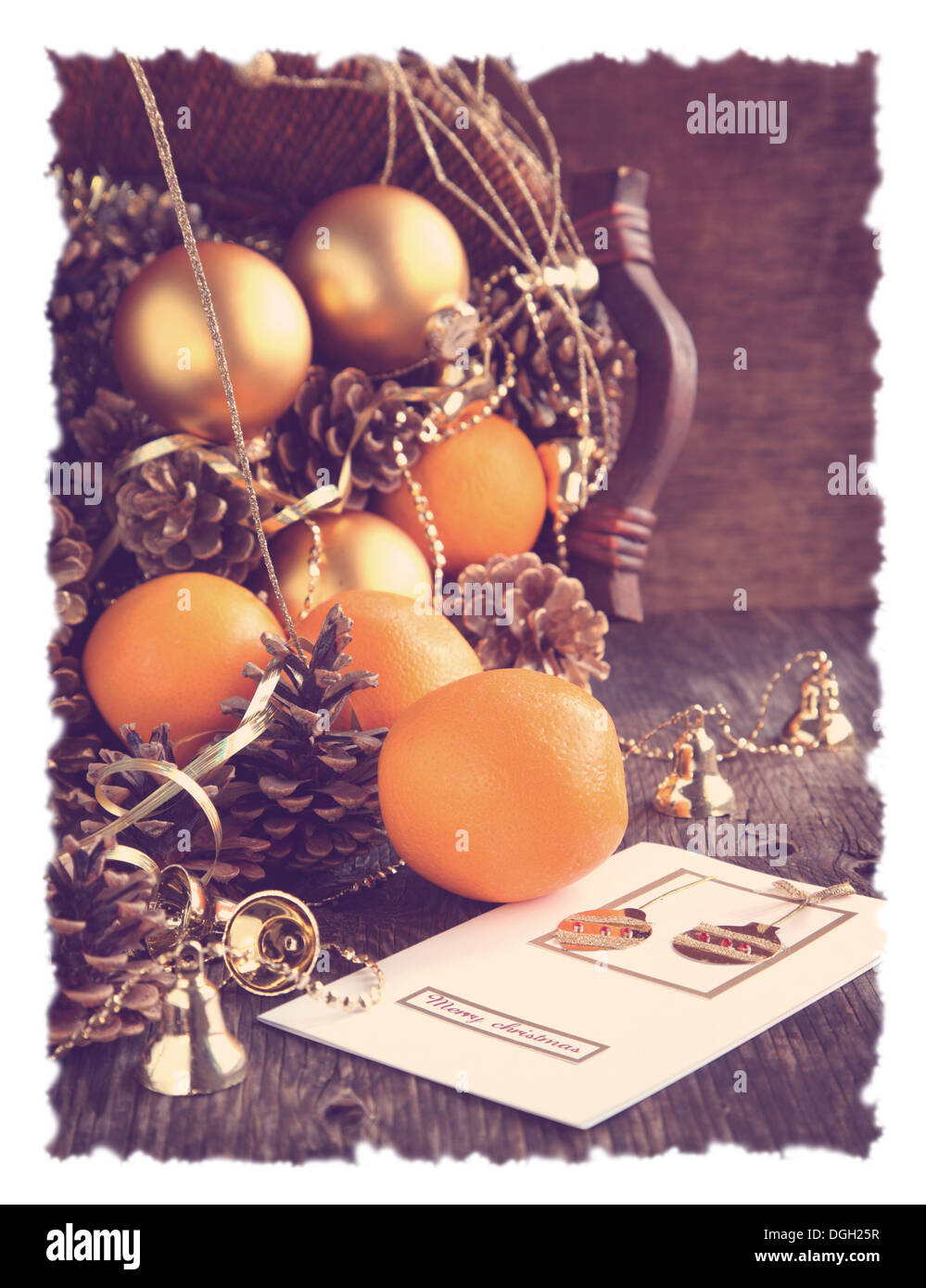 Christmas card and decoration with oranges, pine cones and ornaments Stock Photo