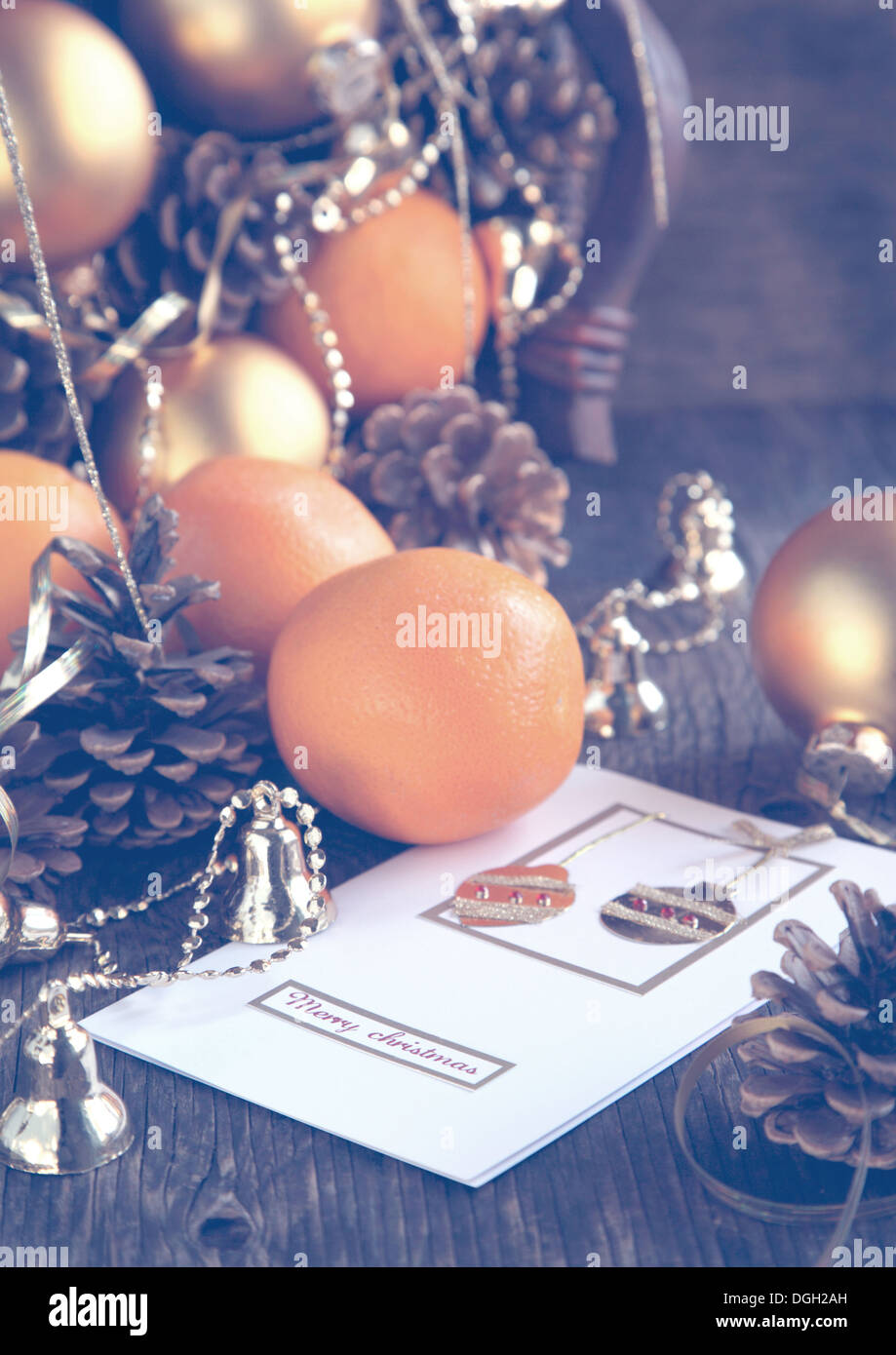 Christmas card and decoration with oranges, pine cones and ornaments Stock Photo