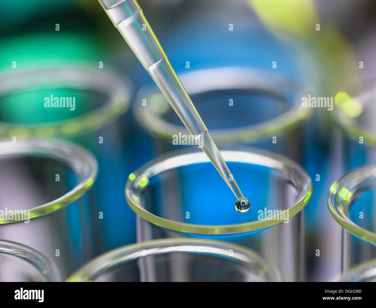 Analytical chemistry sample being pipetted into test tube for Stock