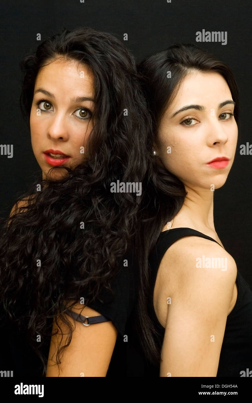 Two beautiful friends back to each other Stock Photo - Alamy