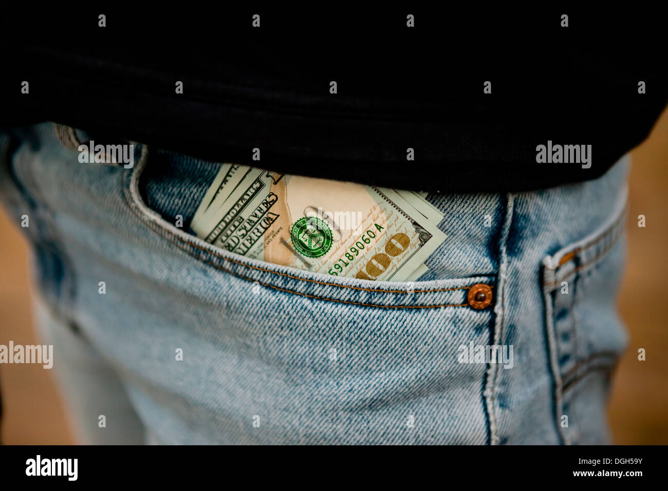 Money sticking out of pants front pocket Stock Photo